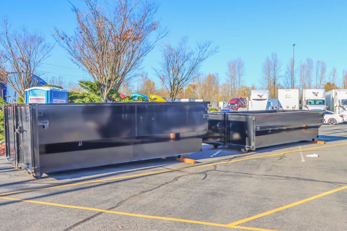 Professional dumpster rental service with roll-off container on residential driveway in St. Petersburg